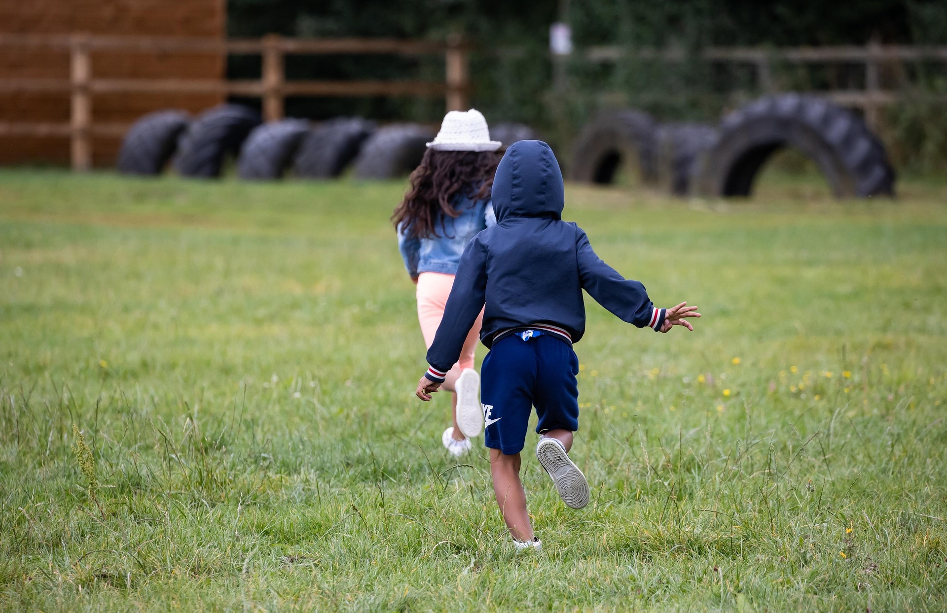 Children running across a field.